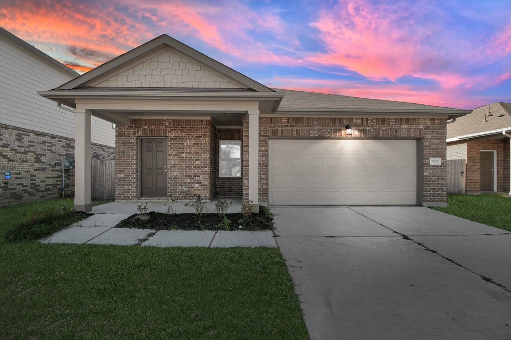A house with a garage and a driveway.