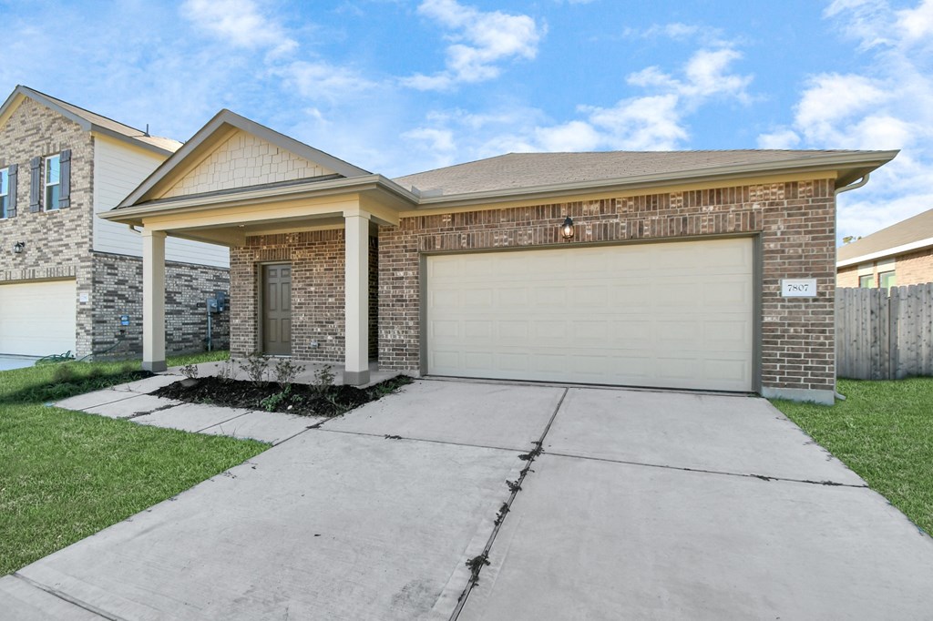 A house with a garage door that is closed.