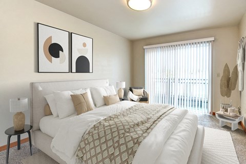 a bedroom with a large bed and a window