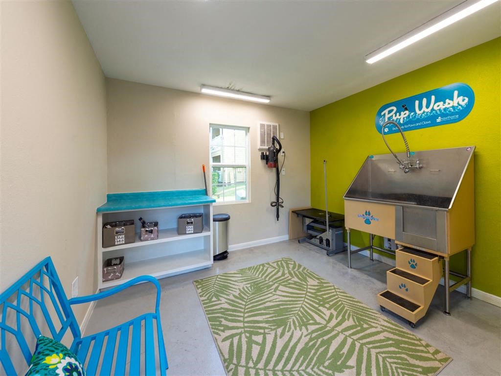 a play room with a hot tub and a table and chairs