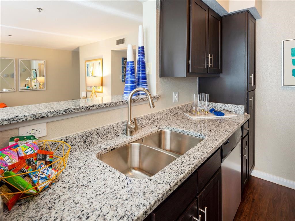 a kitchen with a sink and a counter top