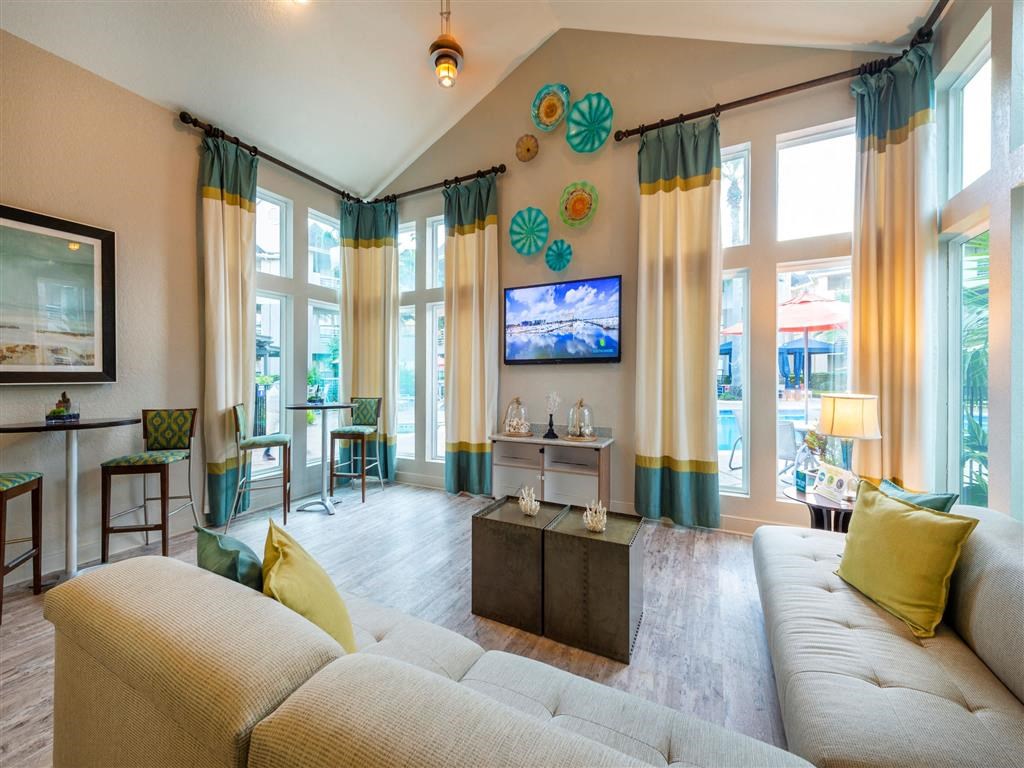 a living room with a couch and a tv