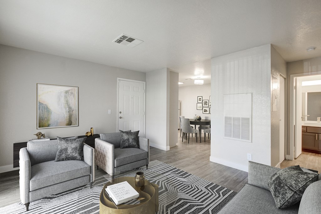 an open living room and dining room with a couch and a table