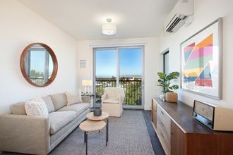 Berkeley CA Luxury Apartments - The Addison - Living Room with Wood-Style Flooring and an Attached Private Patio