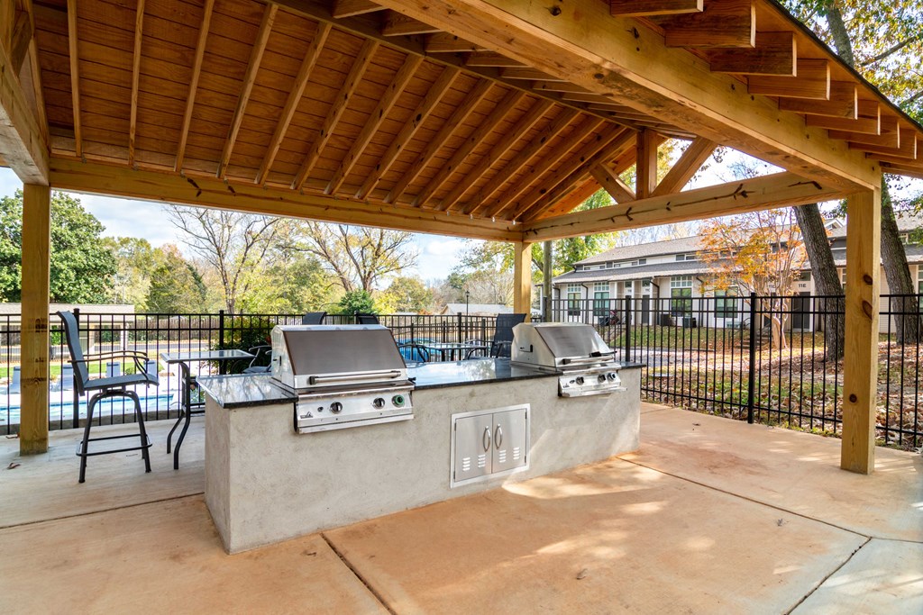 Townhomes for Rent in Smyrna GA - The Arlowe Apartments - Fenced BBQ Pavilion with Two Grilling Stations, Tables, and Chairs