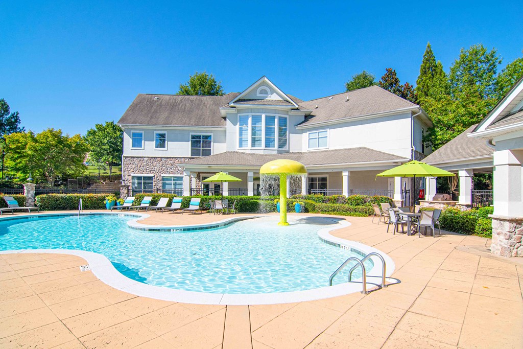 Resort-style saltwater pool with splash area at The Asher at Sugarloaf, a pet-friendly community in Lawrenceville, GA, near Duluth.