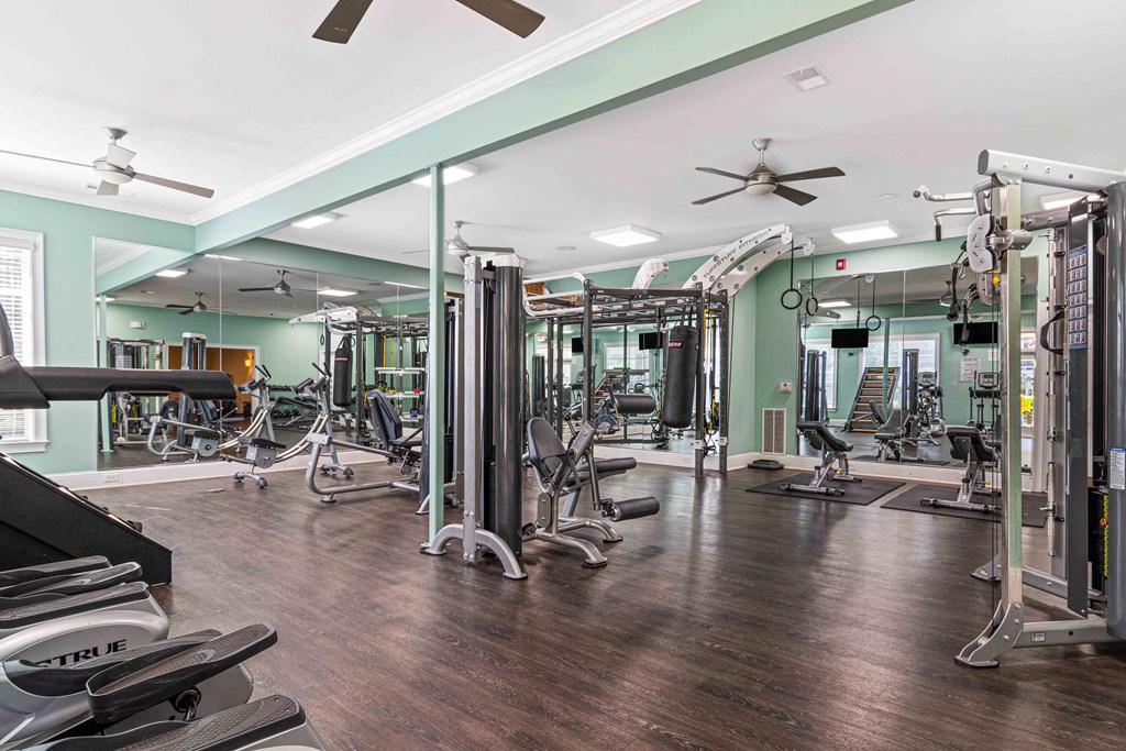 24/7 fitness studio at The Asher at Sugarloaf, a pet-friendly community in Lawrenceville, GA, near Duluth, featuring modern cardio and strength equipment.