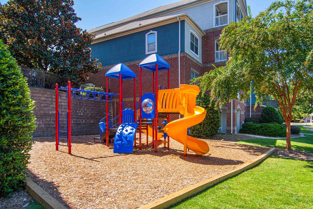 Community playground at The Asher at Sugarloaf, a pet-friendly community in Lawrenceville, GA, near Duluth, offering a safe and fun space for children.