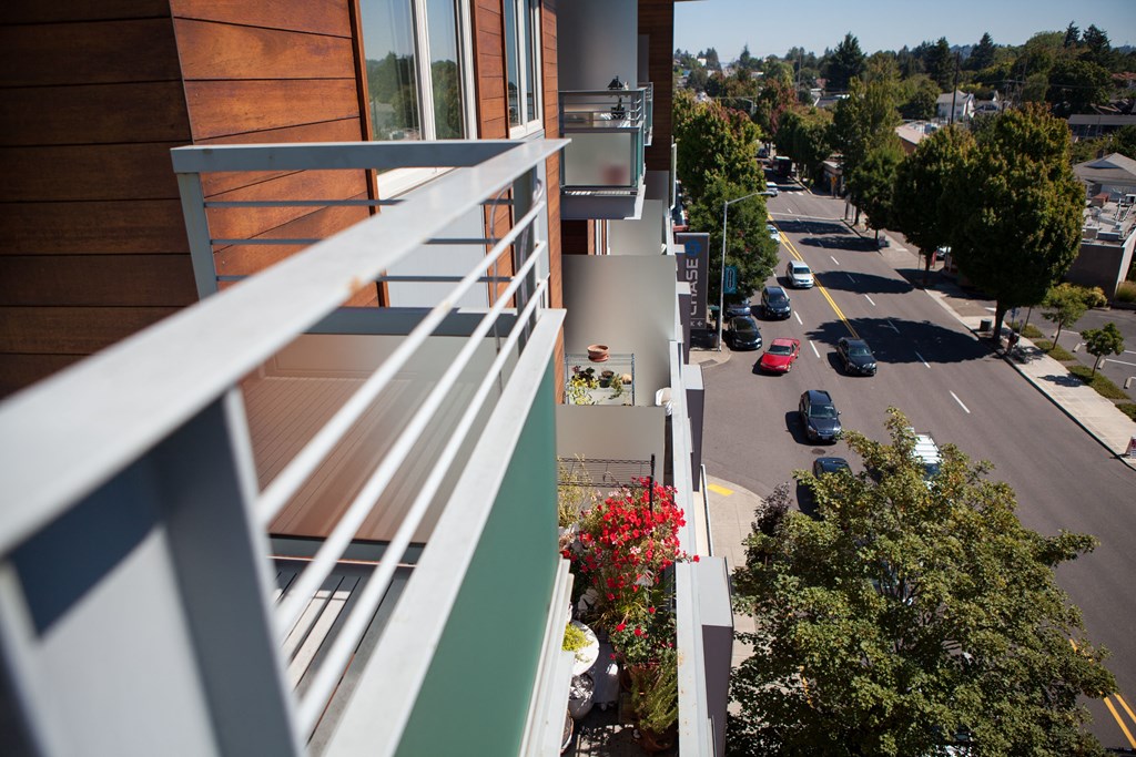 a view of a city street from a balcony of a building