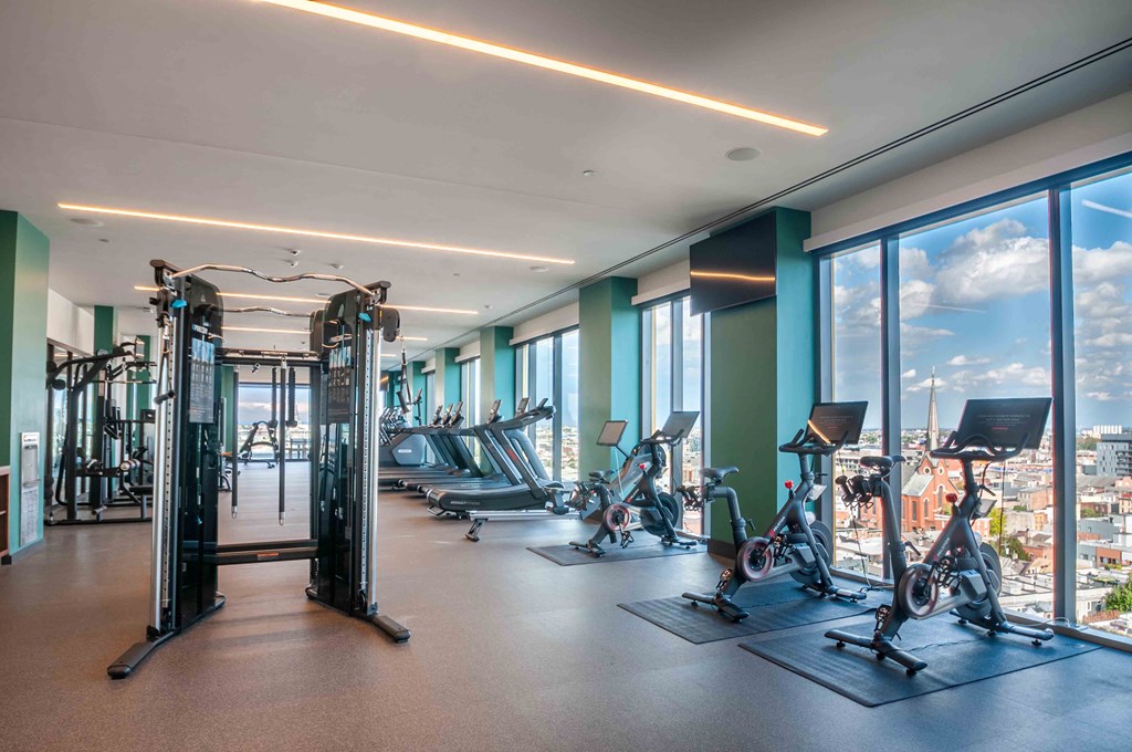 a gym with a view of the city