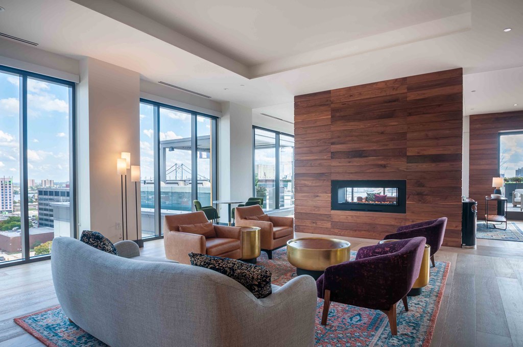 a living room filled with furniture and a fireplace