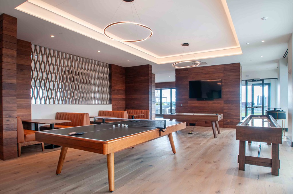 a billiards table in a room with tables and chairs