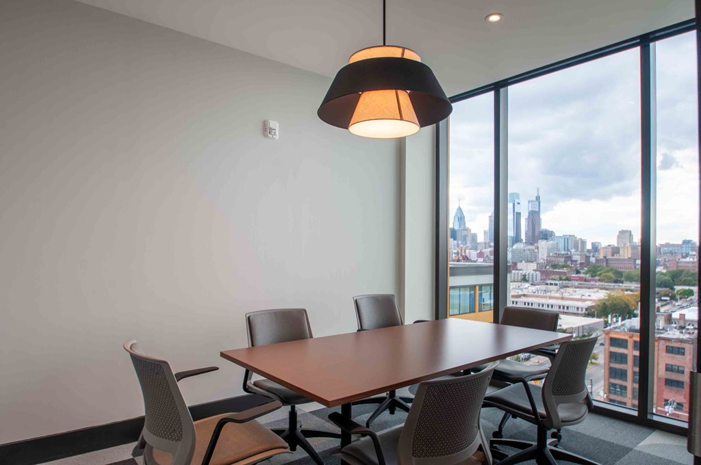 a conference room with a table and chairs