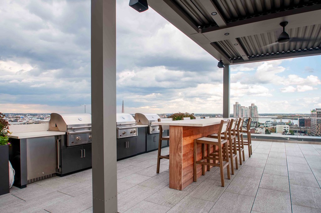 a bar on the roof of a building with a view of the city
