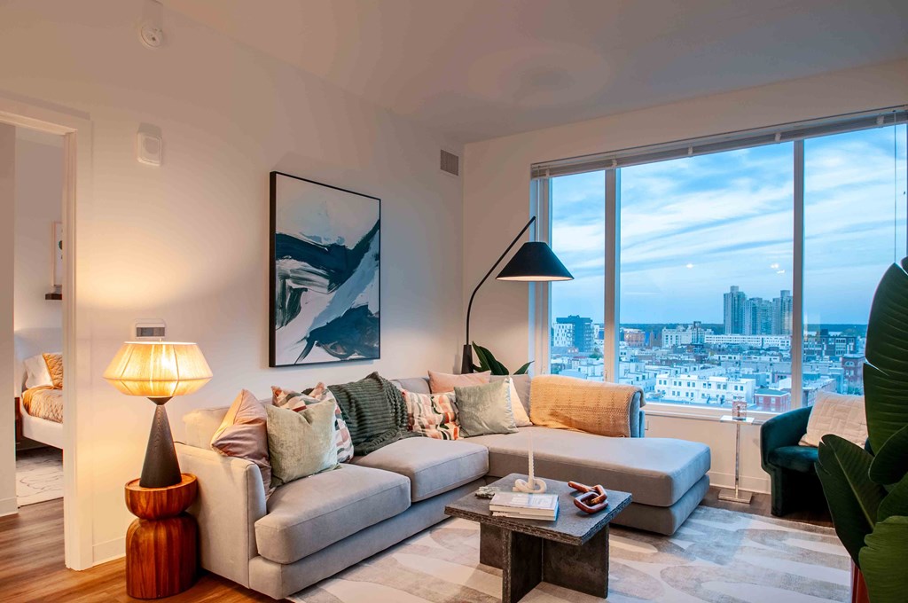 a living room with a couch and a large window