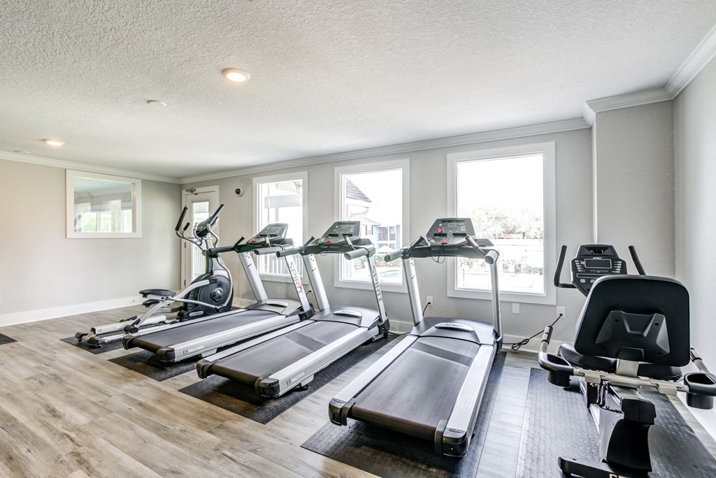 Equipped fitness center at The Commons, a pet-friendly community in Tampa, FL, near Temple Terrace, featuring modern workout equipment.