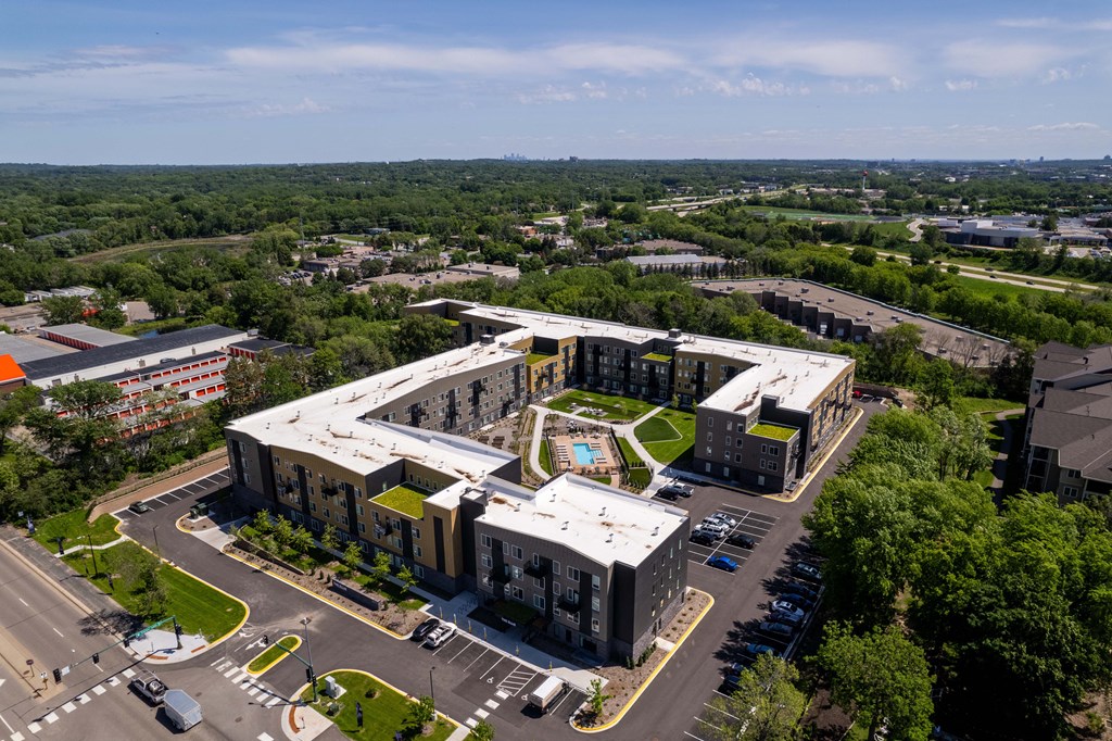 an aerial view of an office building and a parking lot