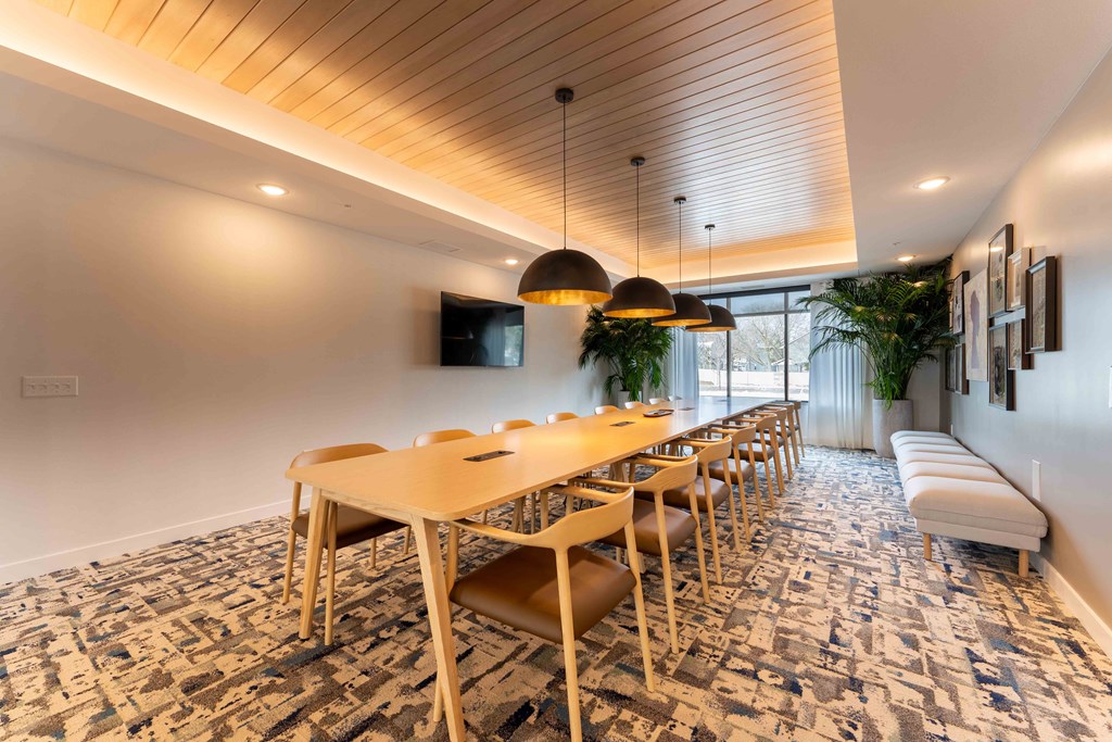 a conference room with a long table and chairs