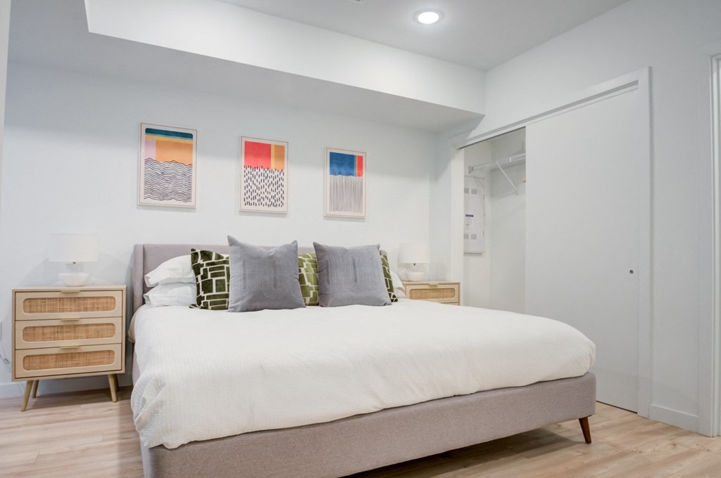 a bedroom with a bed and a closet