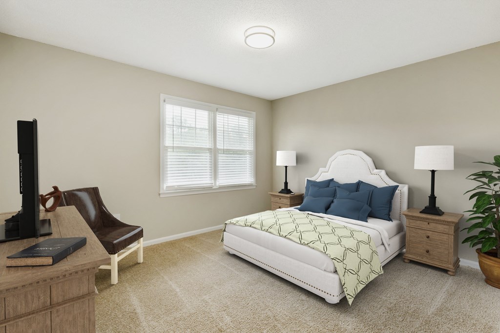 an empty bedroom with a bed and a tv