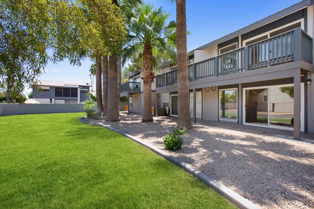 a building with palm trees in front of it