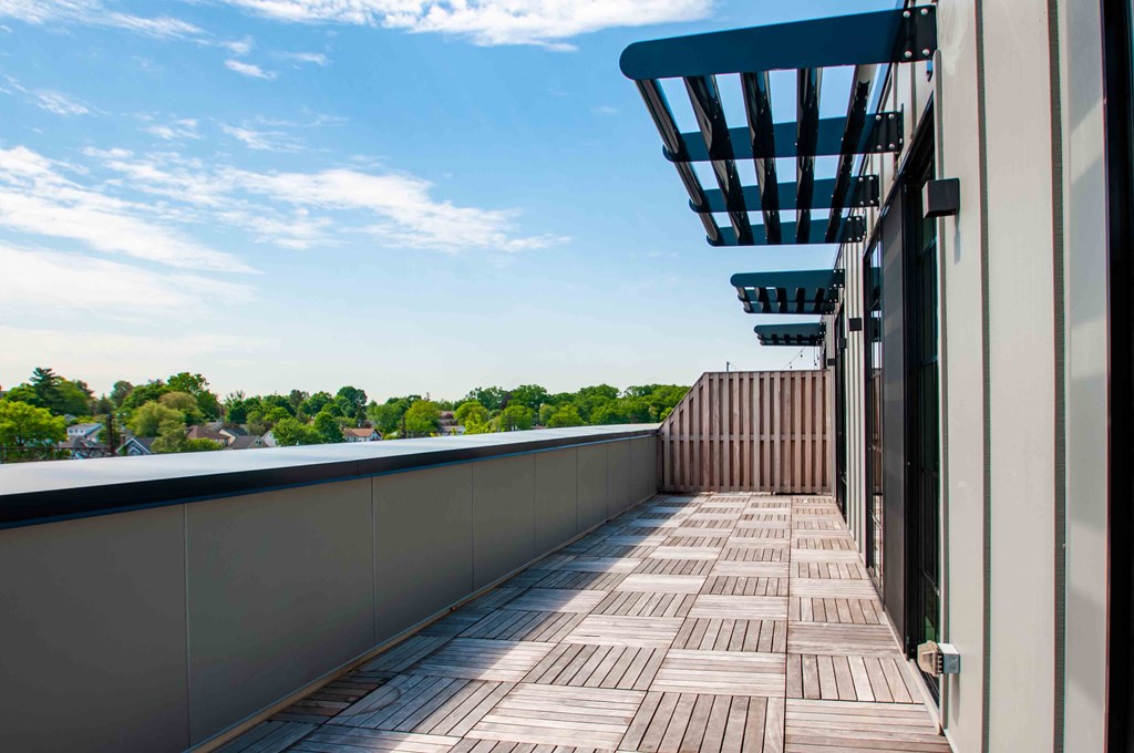 a balcony with a view of a river and a building