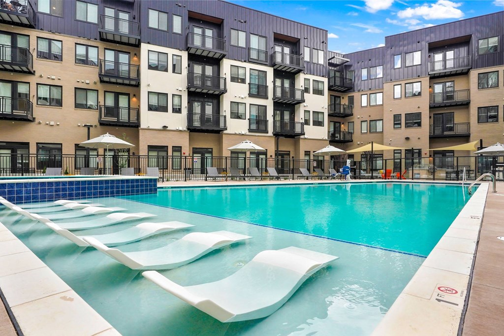Apartments for Rent in Wheat Ridge - Parallel - Resort-Style Pool with In-Water Loungers, Deskside Lounge Chairs, and Spa