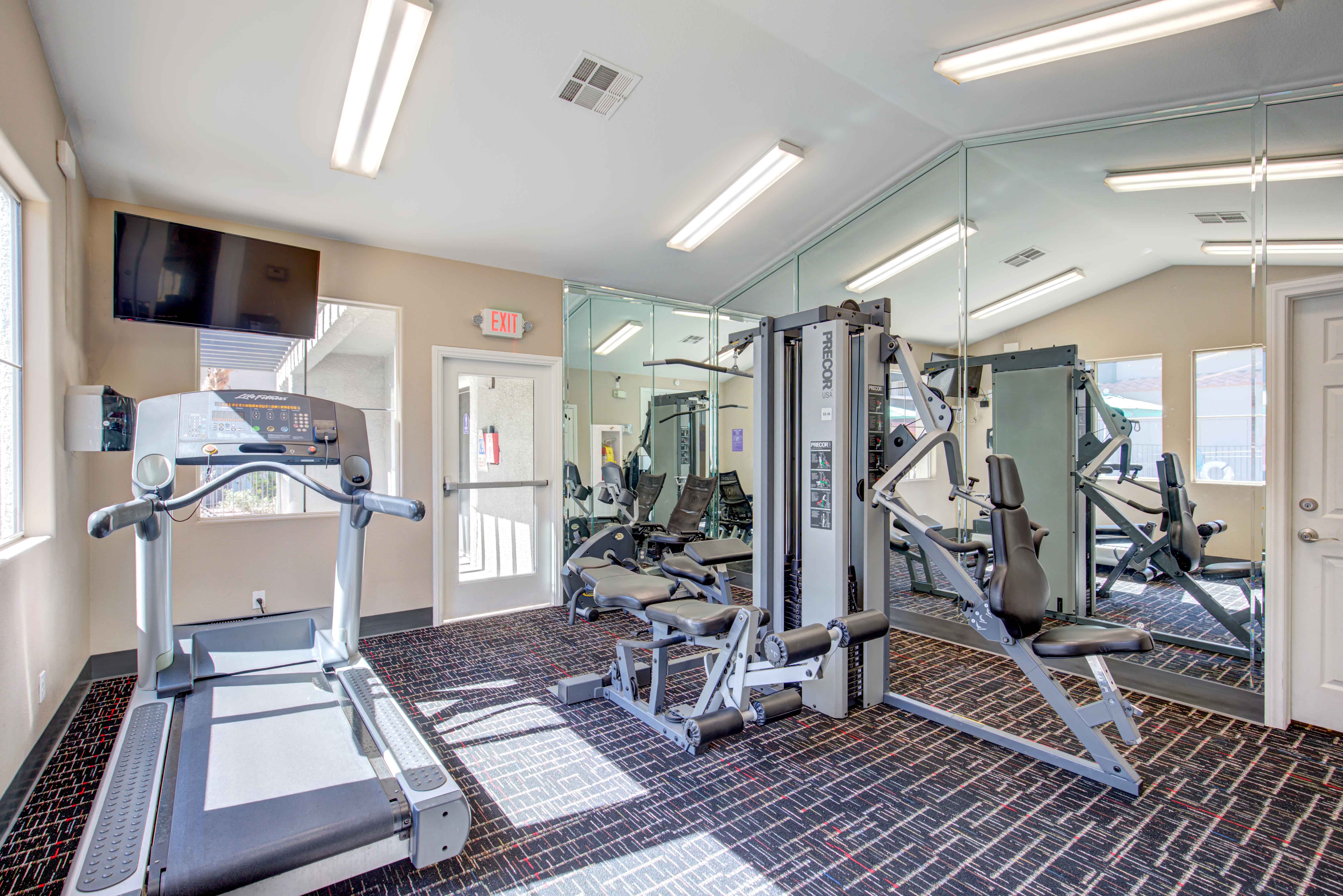 the preserve at ballantyne commons fitness room with weights and a tv