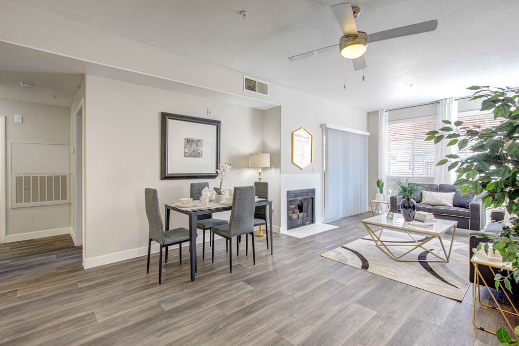 an open living room and dining room with a table and chairs