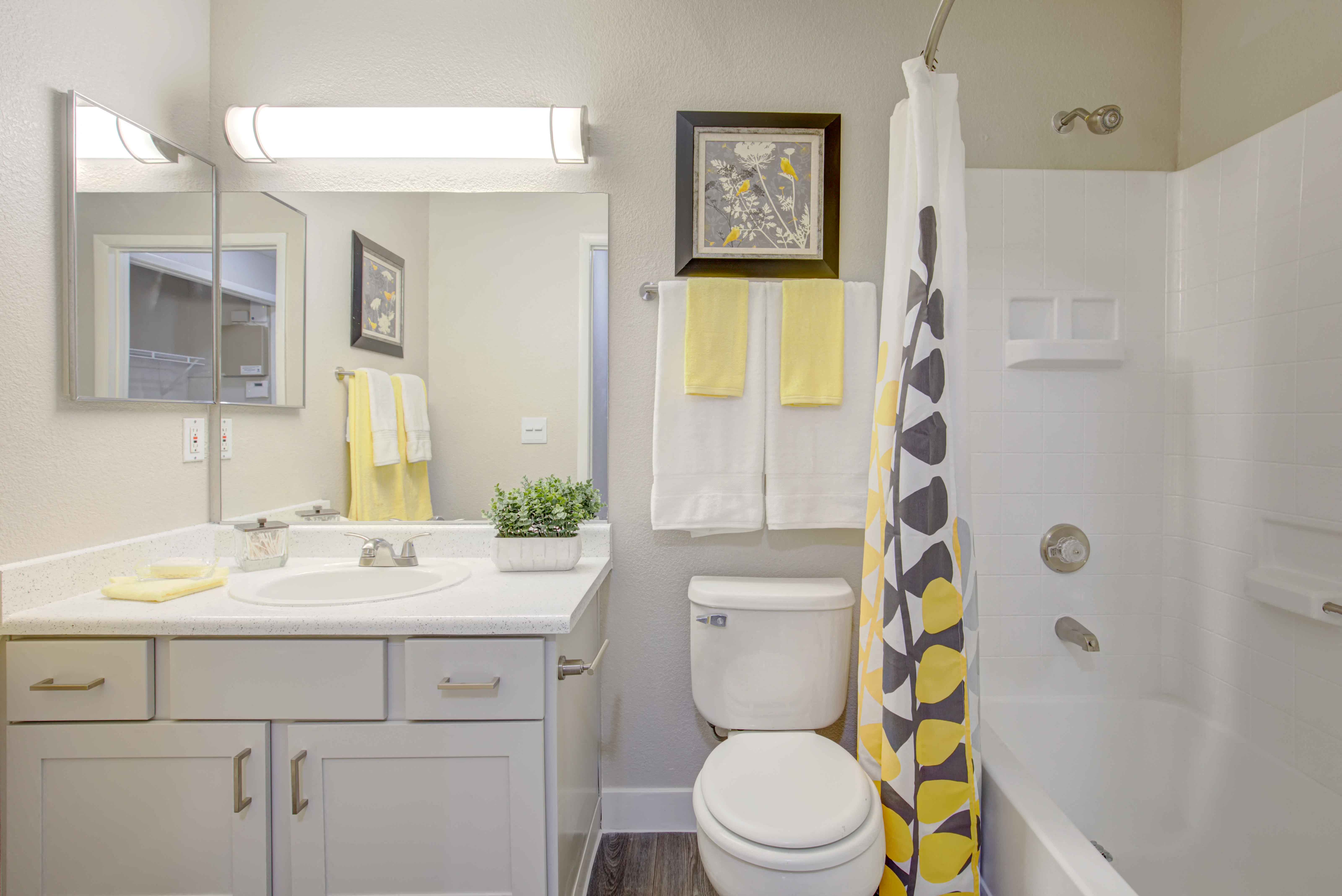 a bathroom with a sink toilet and a shower