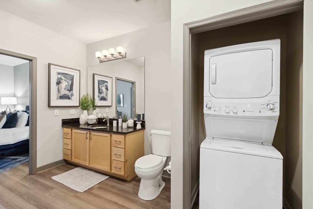 Sage at 1240 apartments in Mount Pleasant South Carolina photo of bathroom with stackable washer and dryer