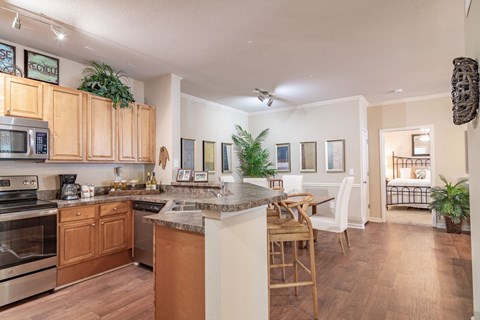 a kitchen with an island and a dining table