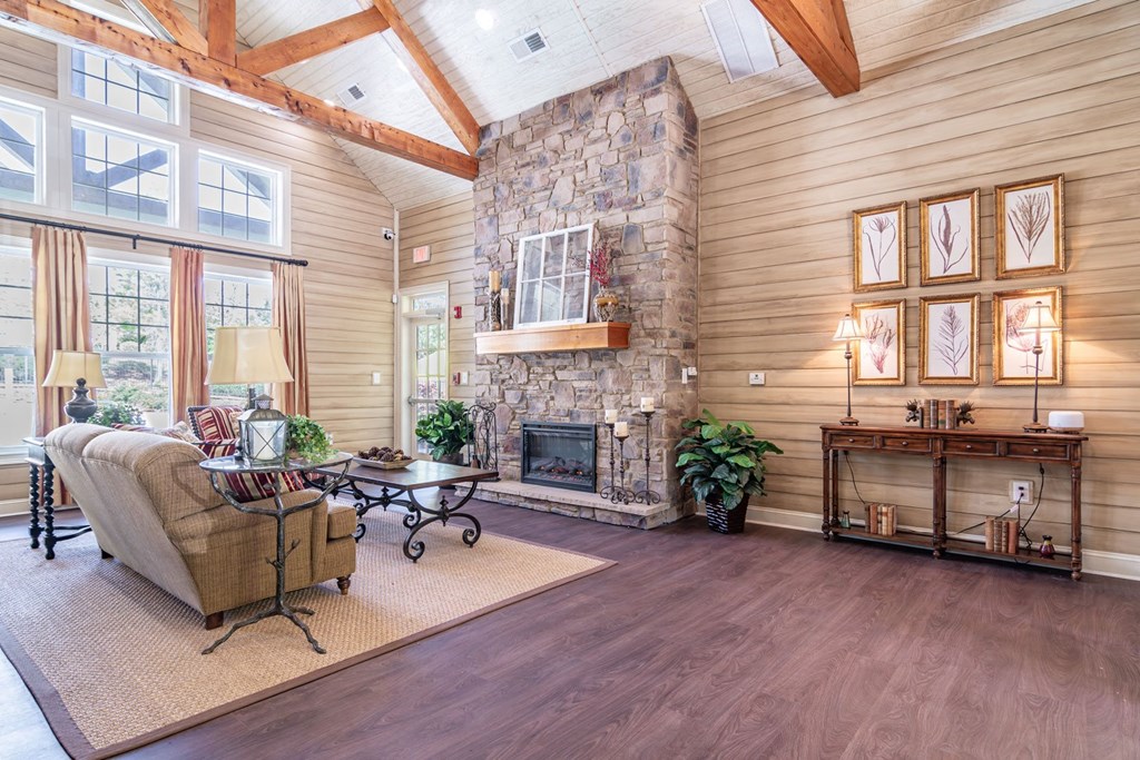 Opelika, AL Apartments – The Crossings of Opelika - clubhouse with high ceilings, seating area and fireplace