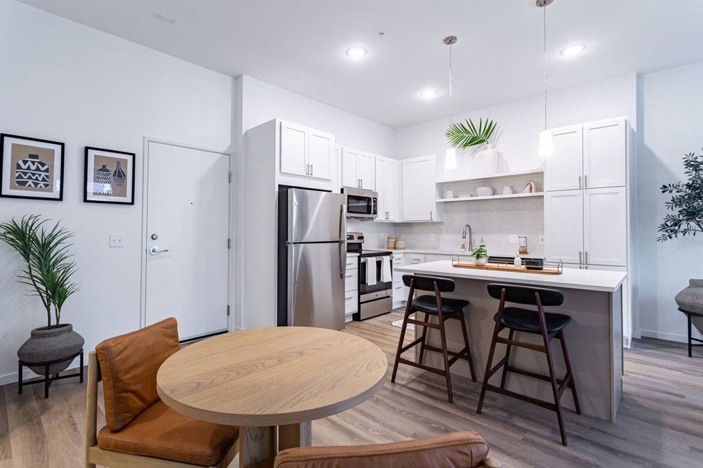 a kitchen with an island and a table