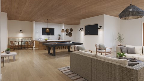 A modern living room with a pool table and a sofa.