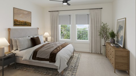 A bedroom with a large bed, a ceiling fan, and a window with curtains.