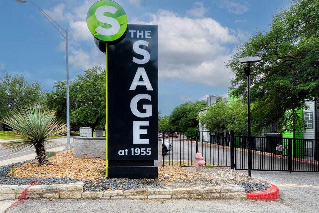 the sign for the sags at 1985 in front of a parking lot