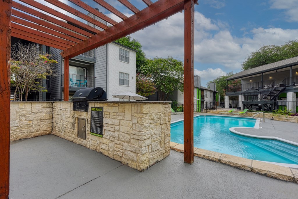the preserve at ballantyne commons pool and patio area with a poolside bar
