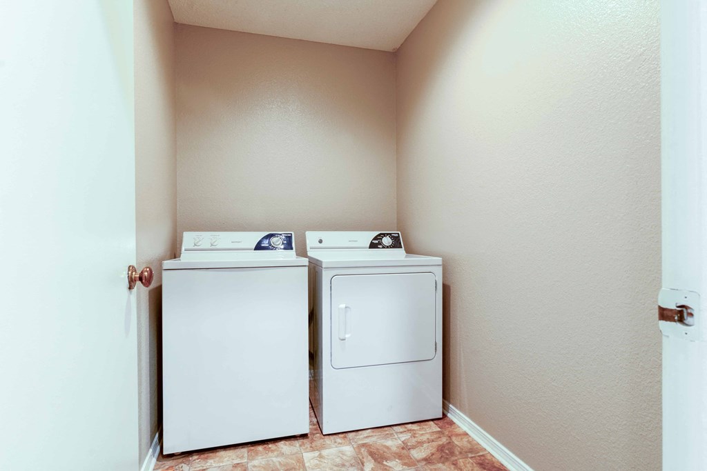 a washer and dryer in a laundry room with a door