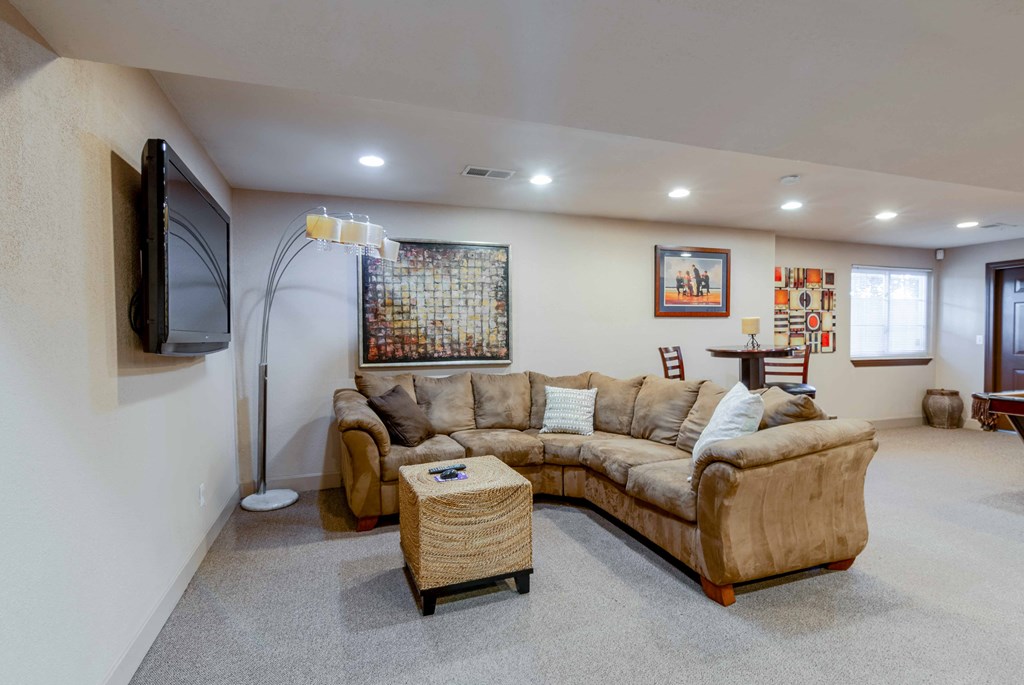 a living room with a couch and a television