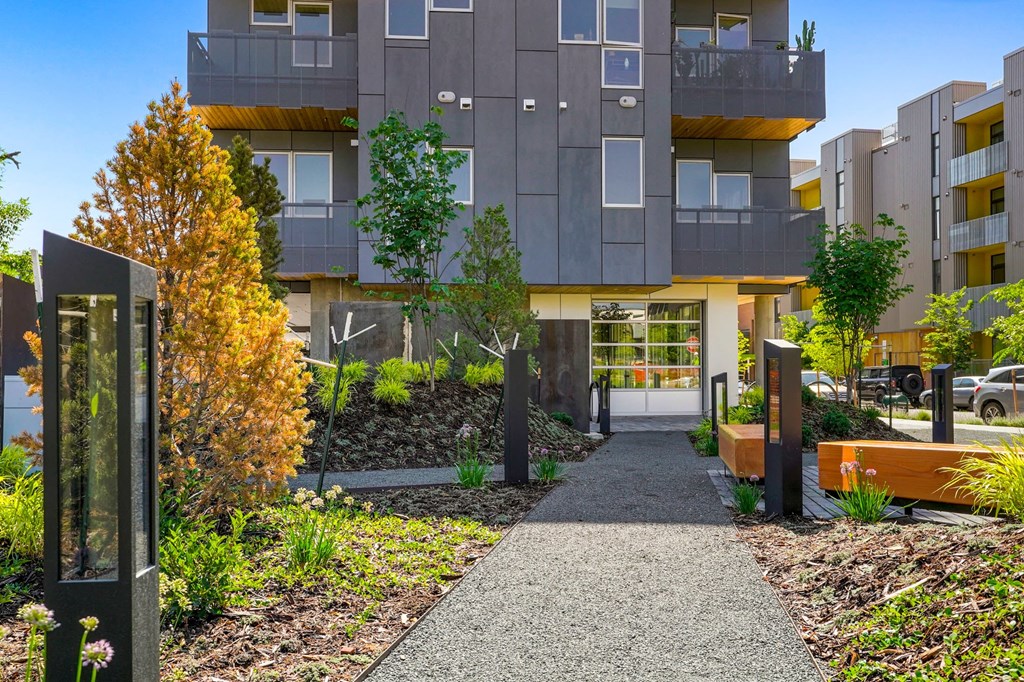 Exterior view of the front of Meredith House with a walkway and landscaping