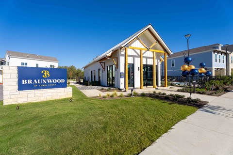 A building with a sign that says Brainwood in front of it.