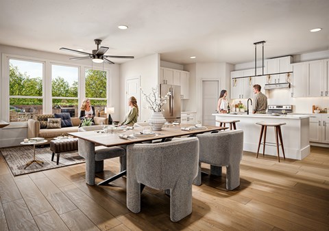 A modern kitchen with a dining table and chairs.