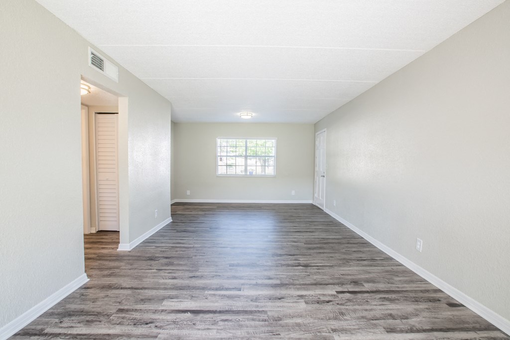 Spacious living room with window and good natural light at Townsend Apartments in Jacksonville near Atlantic Beach, Florida.