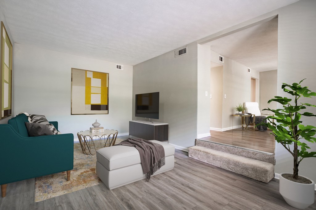 Spacious living room with hardwood-style flooring at Townsend Apartments in Jacksonville near Atlantic Beach, Florida.
