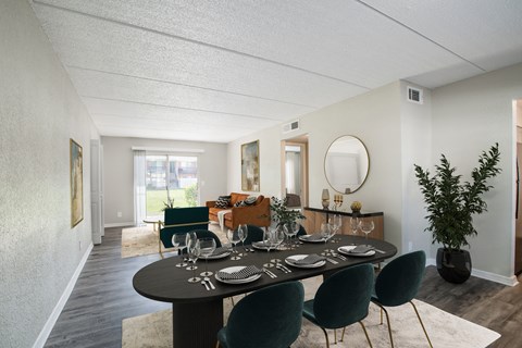 Dining room next to living room with large window and sliding door at Townsend Apartments in Jacksonville near Atlantic Beach, Florida.