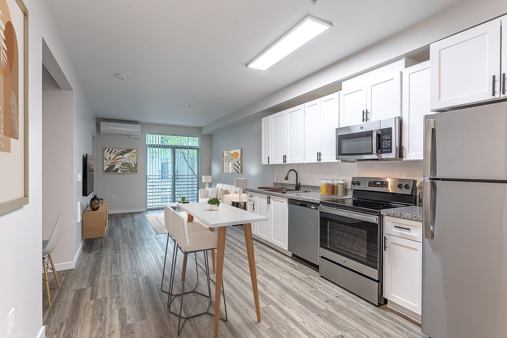 a kitchen and dining area in a 555 waverly unit