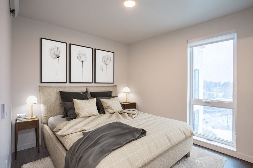 a bedroom with a large bed and a window