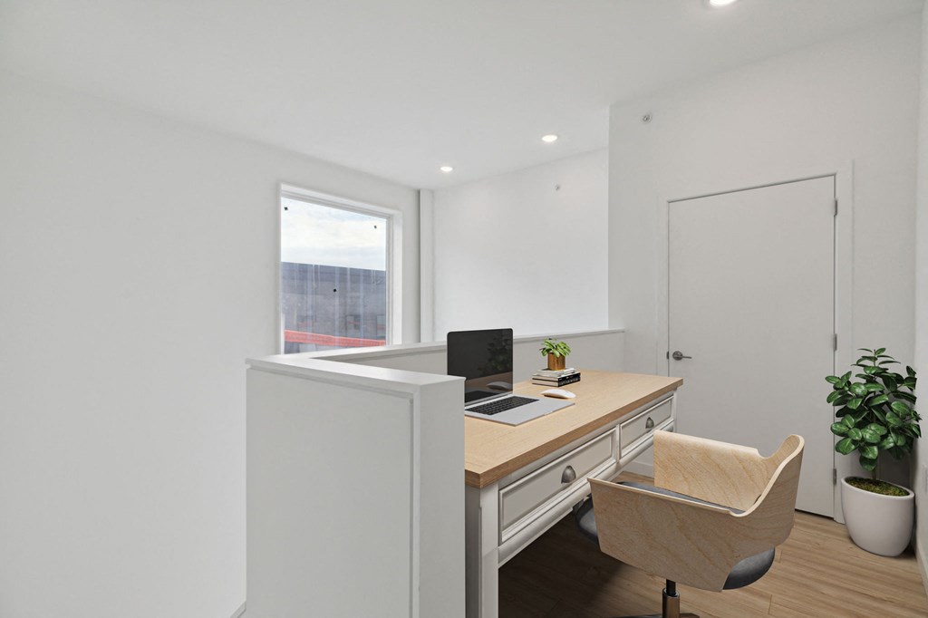 Contemporary kitchen design with white upper cabinets, dark lower cabinets, and a vibrant teal tile backsplash above the countertops.