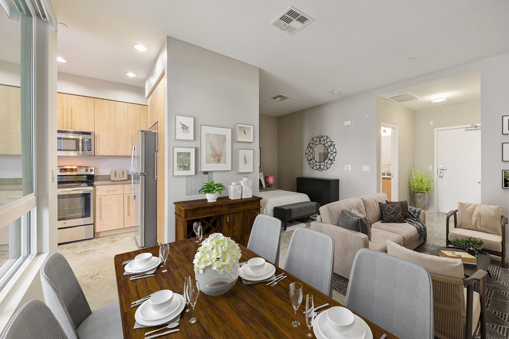 A modern dining room with a wooden table set for six.